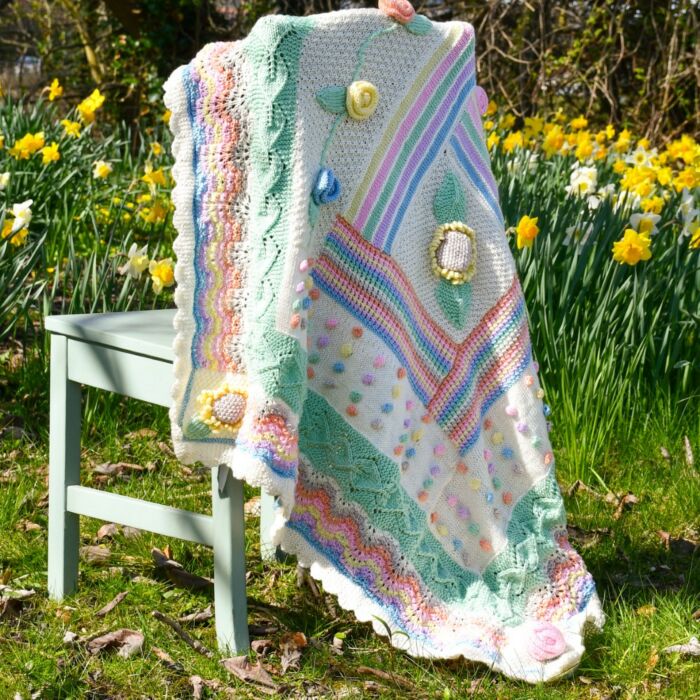Knitted Festival Flower Blanket in WoolBox Imagine Lullaby Baby DK Knitting Pattern main product photo